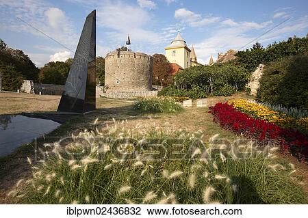 Stock Image - "War monument in front of the Medieval Gate Tower of the Bishop's Castle, Pecs, Pecs, European Cultural City of The Year 2010, Hungary, Europe". Fotosearch