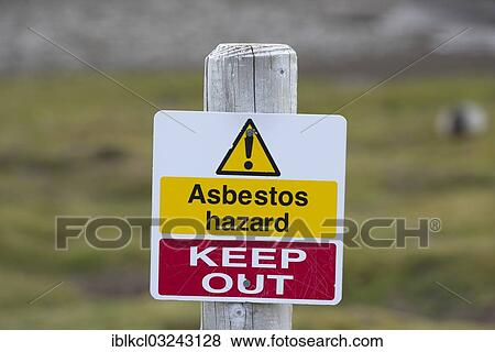 Stock Photo - "Warning sign """"Asbestos hazard - keep out"""" at the Stromness whaling station, Stromness Bay, South Georgia and the South Sandwich Islands, United Kingdom, Antarctica". Fotosearch
