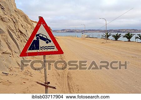 Picture - "Warning sign, """"Caution quayside or river bank"""", Luderitz, Karas Region, Namibia, Africa". Fotosearch