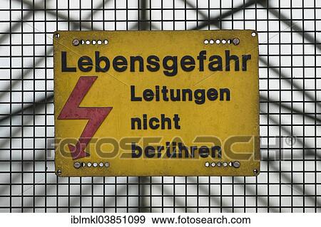 Stock Photo - Warning sign for high voltage lines. Fotosearch