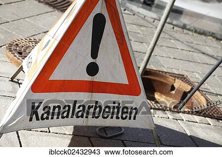 "Warning sign, lettering """"Kanalarbeiten"""", German for """"drain works"""" in the historic district of Ellwangen an der Jagst, Baden-Wuerttemberg, Germany, Europe" View Large Photo Image Stock Image - "Warning sign, lettering """"Kanalarbeiten"""", German for """"drain works"""" in the historic district of Ellwangen an der Jagst, Baden-Wuerttemberg, Germany, Europe". Fotosearch