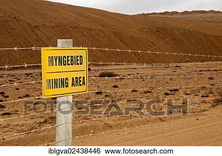 "Warning sign on a barbed wire fence, mining area at the De Beers diamond mining site of? Çï? Çïthe diamond coast between Port Nolloth and Alexander Bay, Northern Cape Province, South Africa, Africa" View Large Photo Image Stock Photograph - "Warning sign on a barbed wire fence, mining area at the De Beers diamond mining site of? Çï? Çïthe diamond coast between Port Nolloth and Alexander Bay, Northern Cape Province, South Africa, Africa". Fotosearch