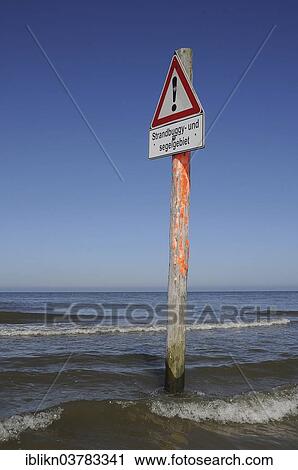 "Warning sign """"Strandbuggy- und Segelgebiet"""", German for """"beach buggy and sailing area, """" North Sea, St. Peter-Ording, Schleswig-Holstein, Germany, Europe" View Large Photo Image Stock Image - "Warning sign """"Strandbuggy- und Segelgebiet"""", German for """"beach buggy and sailing area, """" North Sea, St. Peter-Ording, Schleswig-Holstein, Germany, Europe". Fotosearch