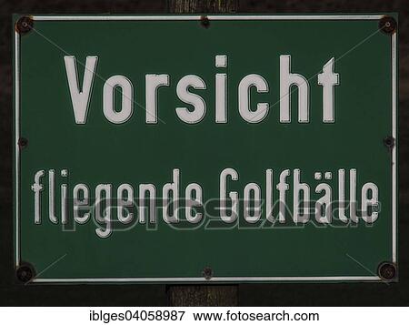"Warning sign, """"Vorsicht, fliegende Golfballe"""", German for """"caution, flying golf balls"""", Sankt Peter-Ording, Schleswig-Holstein, Germany, Europe" View Large Photo Image Stock Photo - "Warning sign, """"Vorsicht, fliegende Golfballe"""", German for """"caution, flying golf balls"""", Sankt Peter-Ording, Schleswig-Holstein, Germany, Europe". Fotosearch