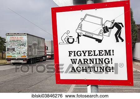 Stock Photograph - "Warning sign, warning against robbery, at a highway rest area, near Budapest, Hungary, Europe". Fotosearch