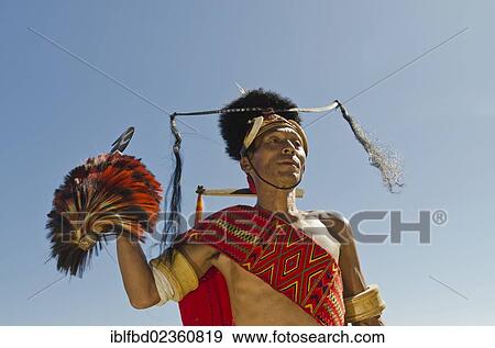 "Warrior of the Konyak tribe waiting to perform ritual dances at Hornbill Festival, Kohima, India, Asia" View Large Photo Image Stock Photo - "Warrior of the Konyak tribe waiting to perform ritual dances at Hornbill Festival, Kohima, India, Asia". Fotosearch