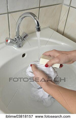 Washing by hand with German curd soap in a washbasin View Large Photo Image Stock Photo - Washing by hand with German curd soap in a washbasin. Fotosearch