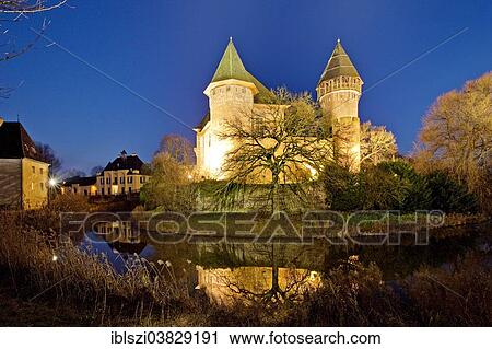 "Wasserschloss Burg Linn, a moated castle in Krefeld-Linn, illuminated at dusk, Lower Rhine region, Westphalia, North Rhine-Westphalia, Germany, Europe" View Large Photo Image Stock Image - "Wasserschloss Burg Linn, a moated castle in Krefeld-Linn, illuminated at dusk, Lower Rhine region, Westphalia, North Rhine-Westphalia, Germany, Europe". Fotosearch