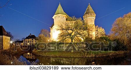 "Wasserschloss Burg Linn, a moated castle in Krefeld-Linn, illuminated at dusk, Lower Rhine region, Westphalia, North Rhine-Westphalia, Germany, Europe" View Large Photo Image Stock Photo - "Wasserschloss Burg Linn, a moated castle in Krefeld-Linn, illuminated at dusk, Lower Rhine region, Westphalia, North Rhine-Westphalia, Germany, Europe". Fotosearch