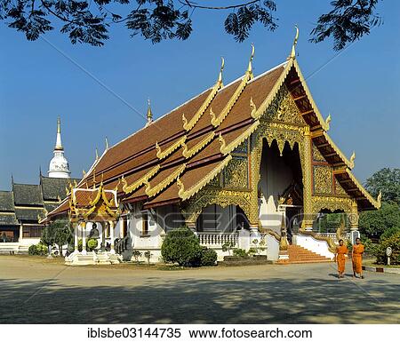 Stock Photography - "Wat Phra Sing Temple, monks in front of the Viharn Luang meeting hall, chedi, Chiang Mai, Northern Thailand, Thailand, Asia". Fotosearch