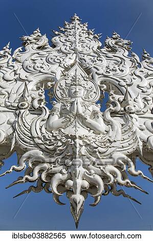 Stock Photography - "Wat Rong Khun, detail of the ornate bridge of the White Temple by the architect and artist Chalermchai Kositpipat, Chiang Rai, Chiang Rai Province, Northern Thailand, Thailand, Asia". Fotosearch