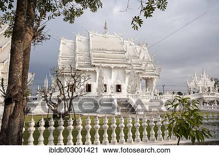 Stock Image - "Wat Rong Khun temple or The White Wat, a Buddhist-Hindu temple by architect Chalermchai Kositpipat, Chiang Rai, Chiang Rai Province, Northern Thailand, Thailand, Asia". Fotosearch