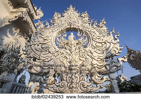 Stock Image - "Wat Rong Khun Temple or White Temple, a Buddhist-Hindu temple, detailed view, Chiang Rai, northern Thailand, Thailand, Asia". Fotosearch