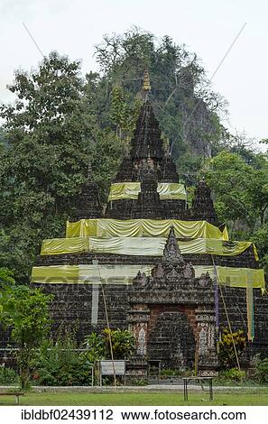 Stock Image - "Wat Tham Pla temple or Monkey Cave temple, Mae Sai region, Chiang Rai province, northern Thailand, Thailand, Asia". Fotosearch