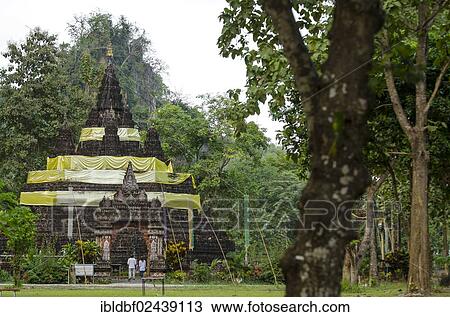 Stock Image - "Wat Tham Pla temple or Monkey Cave temple, Mae Sai region, Chiang Rai province, northern Thailand, Thailand, Asia". Fotosearch