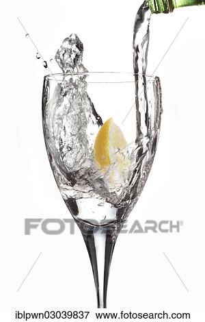 Stock Photo - Water being poured into a glass. Fotosearch
