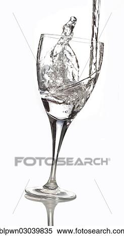 Stock Photography - Water being poured into a glass. Fotosearch