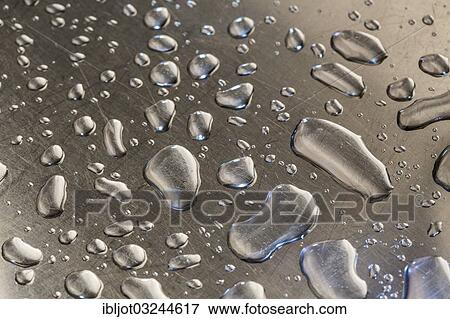 Water droplets on a metal surface View Large Photo Image Stock Photo - Water droplets on a metal surface. Fotosearch
