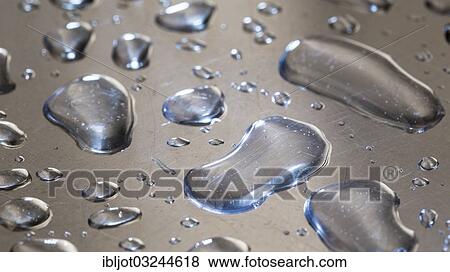 Water droplets on a metal surface View Large Photo Image Stock Photo - Water droplets on a metal surface. Fotosearch