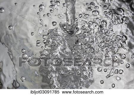 "Water flowing into a basin, symbolic image for water consumption, wasting water" View Large Photo Image Stock Photography - "Water flowing into a basin, symbolic image for water consumption, wasting water". Fotosearch