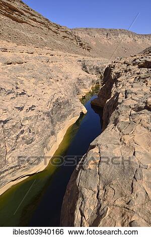 "Water in a guelta at Idaran Canyon, Iherir, Tassili n'Ajjer National Park, Algeria, Africa" View Large Photo Image Stock Photograph - "Water in a guelta at Idaran Canyon, Iherir, Tassili n'Ajjer National Park, Algeria, Africa". Fotosearch