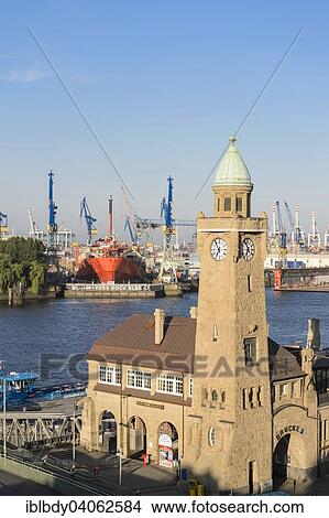 "Water level tower of St. Pauli Landing Stages with the floating storage vessel Petrojarl Banff in the dry dock of Blohm und Voss, Hamburg, Germany, Europe" View Large Photo Image Picture - "Water level tower of St. Pauli Landing Stages with the floating storage vessel Petrojarl Banff in the dry dock of Blohm und Voss, Hamburg, Germany, Europe". Fotosearch