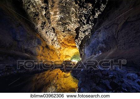 "Water reflections in the cave Cueva de los Verdes, illuminations of the cave system of a lava tube designed by Cesar Manrique, Lanzarote, Canary Islands, Spain, Europe" View Large Photo Image Stock Photograph - "Water reflections in the cave Cueva de los Verdes, illuminations of the cave system of a lava tube designed by Cesar Manrique, Lanzarote, Canary Islands, Spain, Europe". Fotosearch