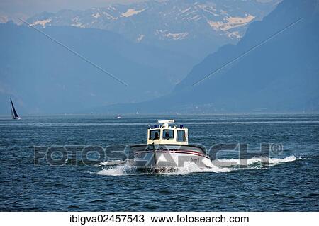 "Water rescue motor boat of Morges on Lake Geneva, near Morges with the Vaud Alps at back, Alpes vaudoises, Canton Vaud, Switzerland, Europe" View Large Photo Image Stock Image - "Water rescue motor boat of Morges on Lake Geneva, near Morges with the Vaud Alps at back, Alpes vaudoises, Canton Vaud, Switzerland, Europe". Fotosearch