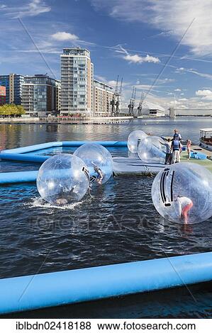 Stock Photo - Water zorbing, Victoria royal docks, London, England, United Kingdom, Europe. Fotosearch