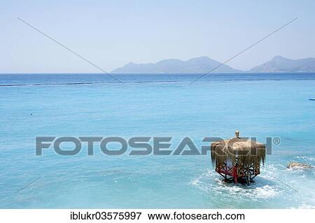 Stock Photo - "Waterfront hut on the beach in the turquoise water of Lykia World Village Hotel Resort, Oludeniz, Mugla Province, Aegean region, Turkey, Asia". Fotosearch