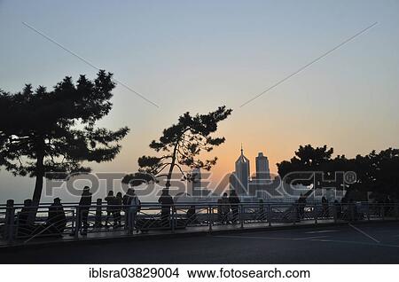 "Waterfront promenade with the skyline of Qingdao, Shandong, China, Asia" View Large Photo Image Picture - "Waterfront promenade with the skyline of Qingdao, Shandong, China, Asia". Fotosearch