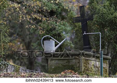 Stock Image - "Watering can at a cemetery, Weimar, Thuringia, Germany, Europe". Fotosearch