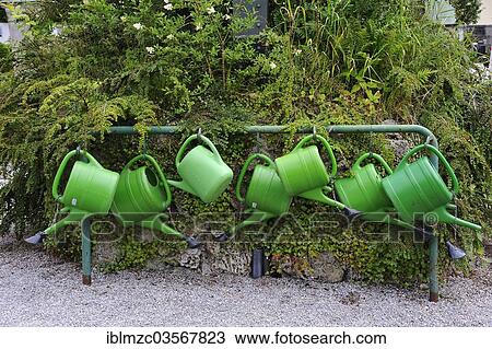 Stock Image - "Watering cans at a cemetery, Tegernsee, Upper Bavaria, Bavaria, Germany, Europe". Fotosearch