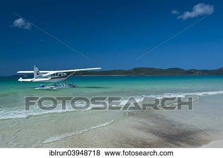 "Waterplane in Whitehaven beach at the Whitsunday Islands, Queensland, Australia, Oceania" View Large Photo Image Stock Photo - "Waterplane in Whitehaven beach at the Whitsunday Islands, Queensland, Australia, Oceania". Fotosearch