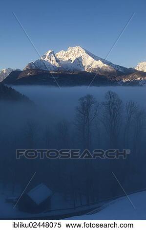 "Watzmann mountain above a sea of fog over Berchtesgadener Land, Bavaria, Germany, Europe" View Large Photo Image Stock Photography - "Watzmann mountain above a sea of fog over Berchtesgadener Land, Bavaria, Germany, Europe". Fotosearch