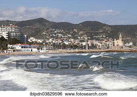 Stock Photograph - "Waves breaking on the sea front, Sitges, Catalonia, Spain, Europe". Fotosearch
