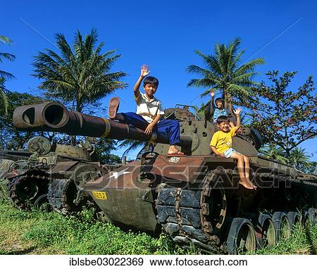 "Waving children sitting on a M48 tank from the U. S. Army, Hue, Provinz Thua Thien-Hue, Vietnam, Asia" View Large Photo Image Stock Photo - "Waving children sitting on a M48 tank from the U. S. Army, Hue, Provinz Thua Thien-Hue, Vietnam, Asia". Fotosearch