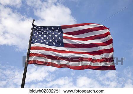 Stock Image - Waving US-American flag. Fotosearch