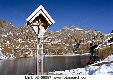 "Wayside cross at Lake Wilden See, looking towards the summit of Wilde Kreuzspitze Mountain, Alto Adige, Italy, Europe" View Large Photo Image Stock Photo - "Wayside cross at Lake Wilden See, looking towards the summit of Wilde Kreuzspitze Mountain, Alto Adige, Italy, Europe". Fotosearch
