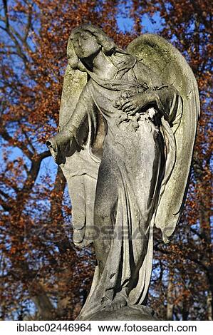 "Weathered angel statue on the Ostfriedhof or East Cemetery, Munich, Bavaria, Germany, Europe" View Large Photo Image Picture - "Weathered angel statue on the Ostfriedhof or East Cemetery, Munich, Bavaria, Germany, Europe". Fotosearch
