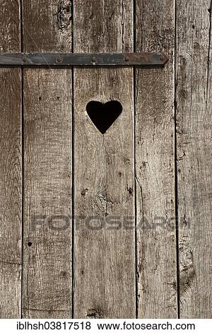 "Weathered wooden door with a heart, outside toilet" View Large Photo Image Stock Photo - "Weathered wooden door with a heart, outside toilet". Fotosearch