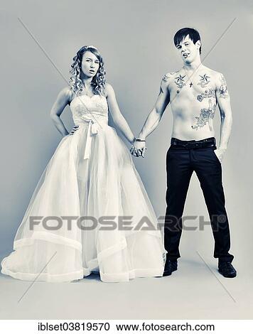 "Wedding picture, bride and groom, bare chested groom with tattoos" View Large Photo Image Stock Image - "Wedding picture, bride and groom, bare chested groom with tattoos". Fotosearch