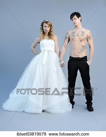 Stock Photo - "Wedding picture, bride and groom, bare chested groom with tattoos". Fotosearch