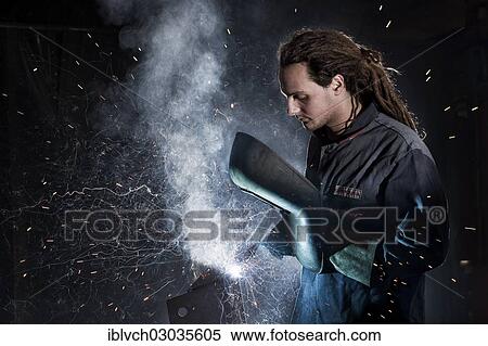 "Welder welding with protective equipment, Kundl, Kufstein District, North Tirol, Tirol, Austria, Europe" View Large Photo Image Stock Photography - "Welder welding with protective equipment, Kundl, Kufstein District, North Tirol, Tirol, Austria, Europe". Fotosearch