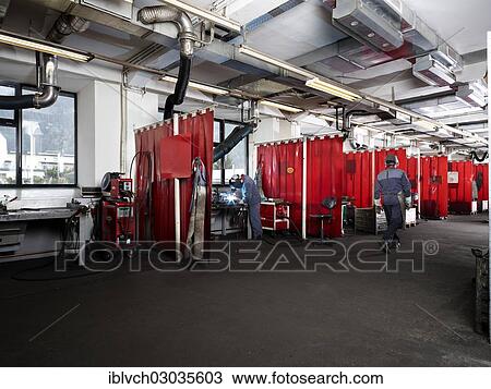 Stock Image - "Welding hall with compartments for welding, Kundl, Kufstein District, North Tirol, Tirol, Austria, Europe". Fotosearch