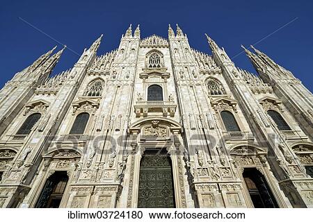 Stock Image - "West facade of Milan Cathedral or Duomo di Santa Maria Nascente, Milan, Lombardy, Italy, Europe". Fotosearch