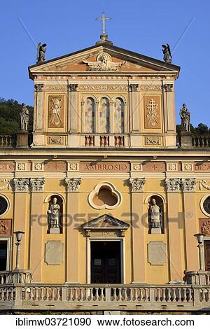 Stock Image - "West facade of the Parish Church of Sancto Ambrosio in the evening light, Porto Ceresio, Lombardy, Italy, Europe". Fotosearch