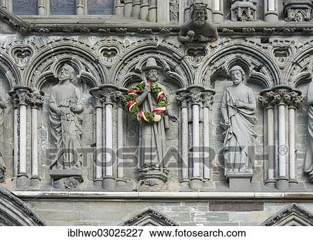 Stock Photo - "West facade on Nidaros Cathedral in Trondheim, detail with statues of saints, the apostle James the Greater is decorated with a wreath, Trondheim, Sor-Trondelag, Trondelag, Norway, Europe". Fotosearch