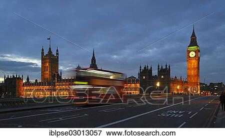 Stock Photo - "Westminster Bridge, Elizabeth Tower or Big Ben, Houses of Parliament, passing red double-decker bus in the evening, City of Westminster, London, London region, England, United Kingdom, Europe". Fotosearch