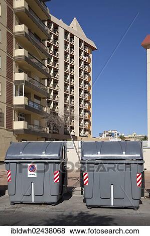 Stock Photo - "Wheeled trash cans standing in front of an apartment complex, Fuengirola, Costa del Sol, Andalusia, Spain, Europe, PublicGround, Europe". Fotosearch